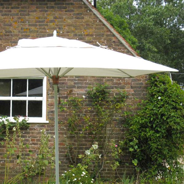 Tradewinds 2m x 3m aluzone parasol, rectangular parasol by house wall with Ecru canvas